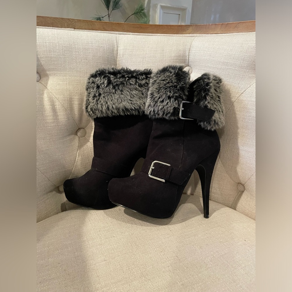 Tall black heel boots with fur.